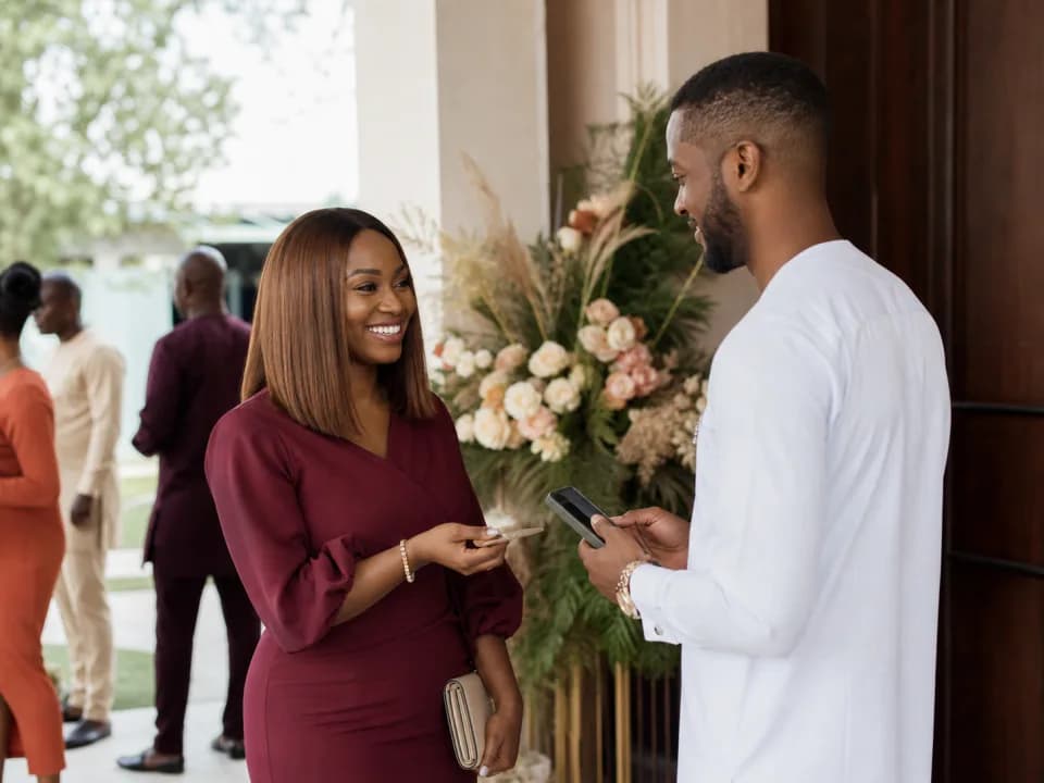 Wedding guest being welcomed and checked in at a Nigerian venue