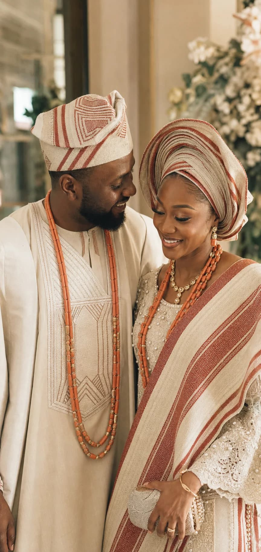 Nigerian couple in coordinated traditional wedding attire sharing a quiet moment